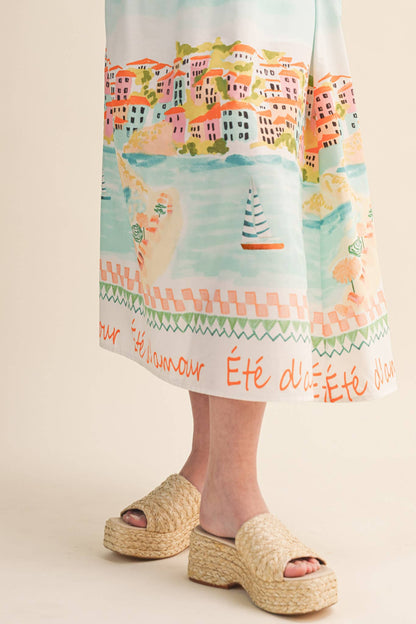 LETS GETAWAY LANDSCAPE PRINT BOW TYING MIDI DRESS BLUE